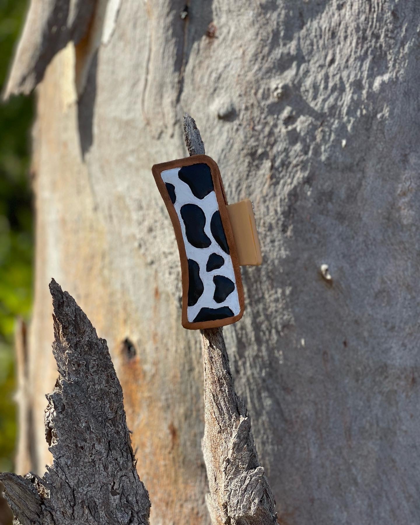 Cow print tooled leather claw clip