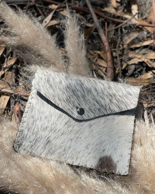 Handmade, hand stitched cowhide Clutch